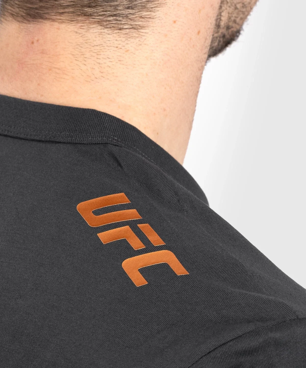 56be565f001b062f2a4b117e1f9690f623e47059_TS_UFC_FW_ADRENALINE_BLACK_BRONZE_9_bd3c5ea4-9c33-4315-a112-8fc084fa93e4 UFC Adrenaline by Venum Fight Week Men’s Short Sleeve T-shirt - Charcoal Grey - Image 2